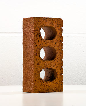 Lazy Brick – conceptual sculpture of a single brick, justified as art using AI, front view