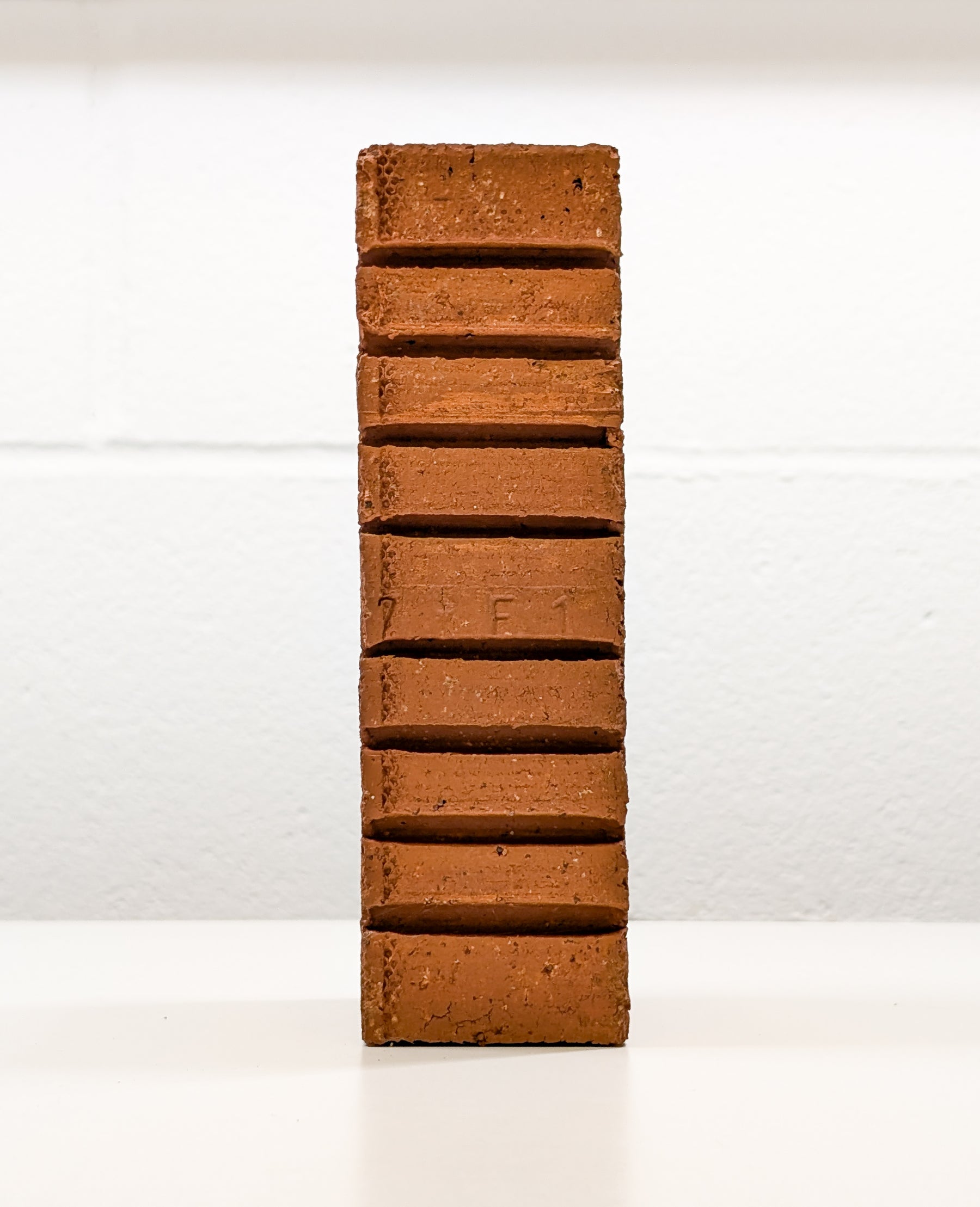 Side view of Lazy Brick, a conceptual art piece by Dan Berg exploring AI’s role in creative justification