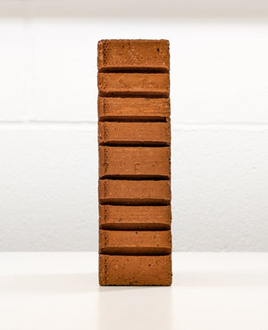 Side view of Lazy Brick, a conceptual art piece by Dan Berg exploring AI’s role in creative justification