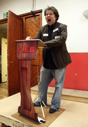 Rich Fulcher performing comedy at PLEB Talks